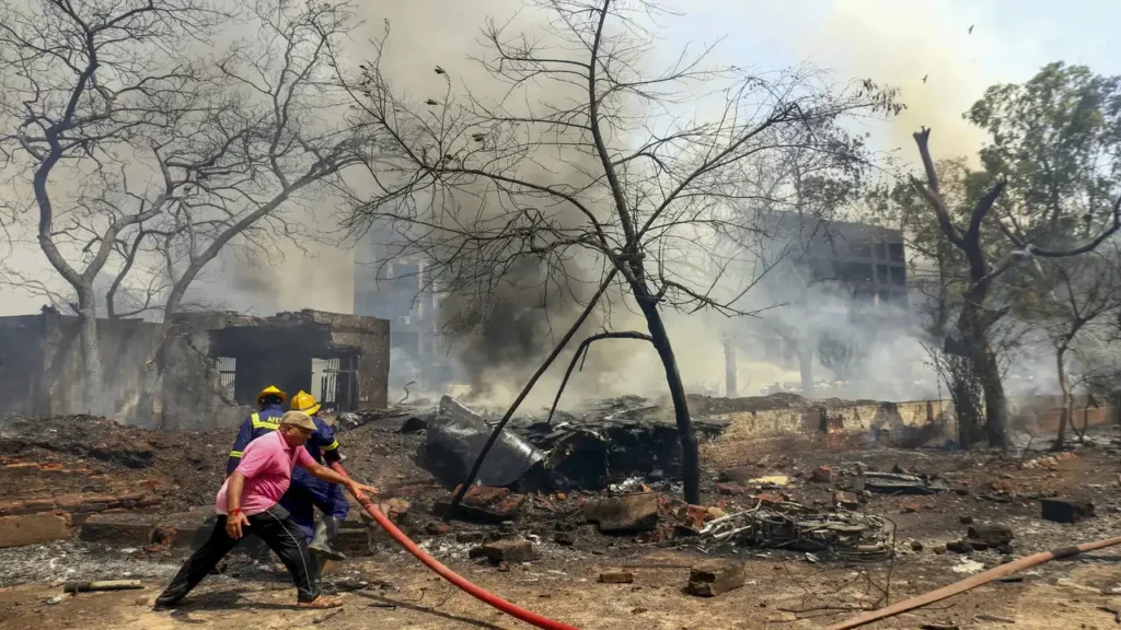 Aftermath of Ahmedabad plane tragedy near Gujarat medical college with local people offering help
